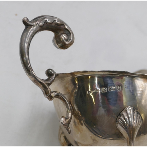 270 - A Birmingham silver sauceboat with crickle rim, scroll handle and splayed feet 2.6oz