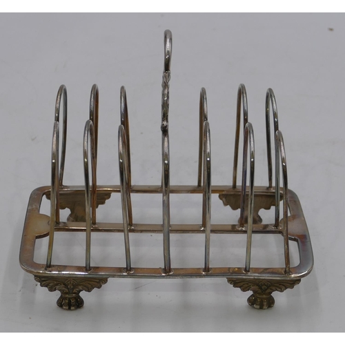 275 - A George III 7-bar toast rack with centre carrying handle on splayed claw feet, London 1821, makers ... 