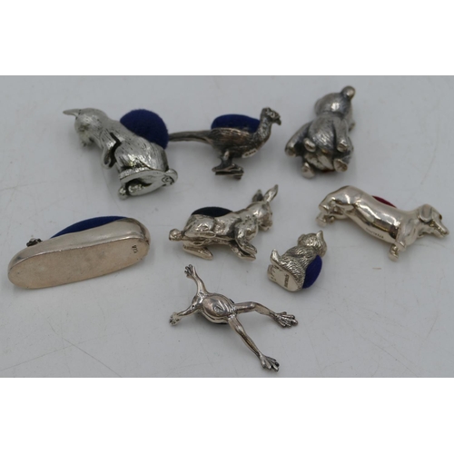 288 - Five 925 sterling silver small pin cushions in the form of a frog, hare, dog etc, 3 other pin cushio... 