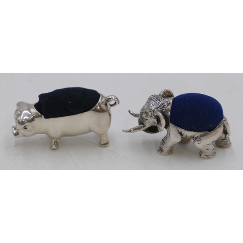 290 - A Sterling silver small pin cushion in the form of an elephant and another silver pin cushion in the... 