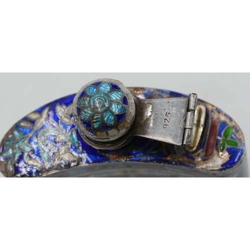 297 - A 925 silver and enamel concaved shaped hip flask on blue ground with multicoloured floral and leaf ... 