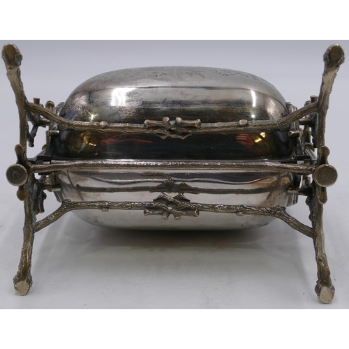 301 - A silver plated folding breakfast dish with hinged double sides, on branch shaped supports and splay... 