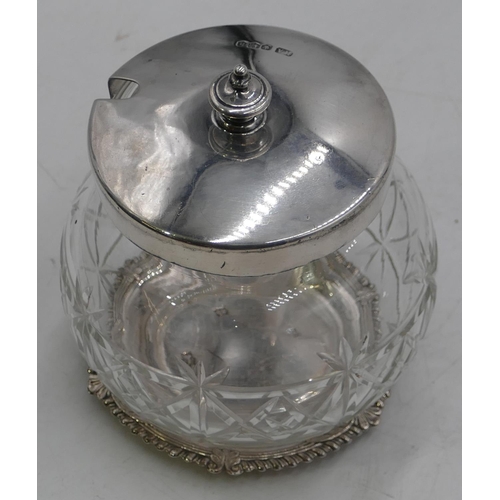 309 - A round bulbous cut glass jam pot with Sheffield silver lid (slight chip to rim), a modern Birmingha... 