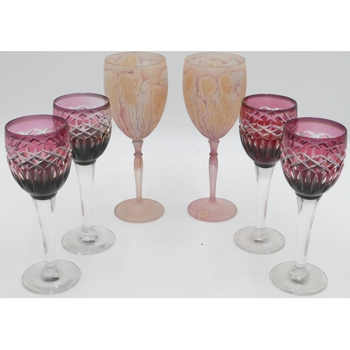 31 - A set of 4 ruby and clear glass wine glasses, 19.3cm high and a pair of taller pink wine glasses. (6... 