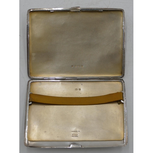 311 - A Birmingham silver cigarette case with engine turn decoration, hinged front, 11.5cm high, 4.7oz.