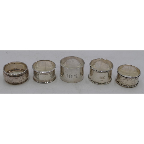 312 - A heavy plain Sheffield silver napkin ring and 4 other silver napkin rings, 5.2oz.