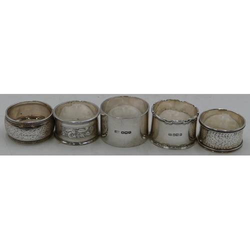 312 - A heavy plain Sheffield silver napkin ring and 4 other silver napkin rings, 5.2oz.