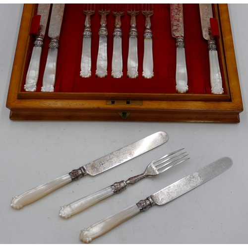 319 - A set of 12 silver plated and mother of pearl handled fruit knives, 12 knives, 12 forks in a fitted ... 