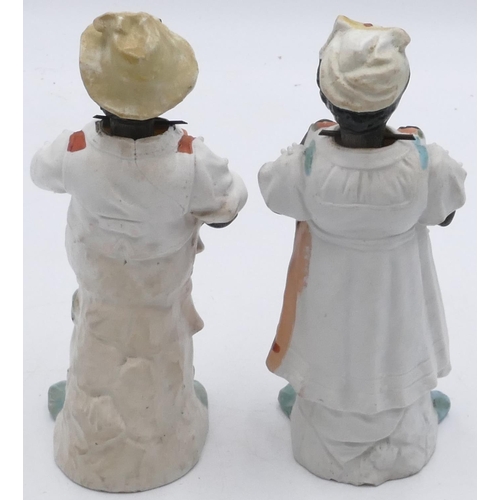 32 - A pair of Bisque china figures of gentleman and lady, 19cm high.