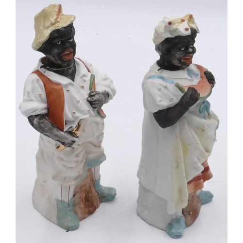 32 - A pair of Bisque china figures of gentleman and lady, 19cm high.