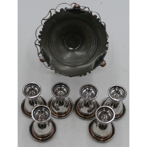 320 - A silver plated circular stand with centre carrying handle, mounted with 6 egg cups on 3 splayed fee... 