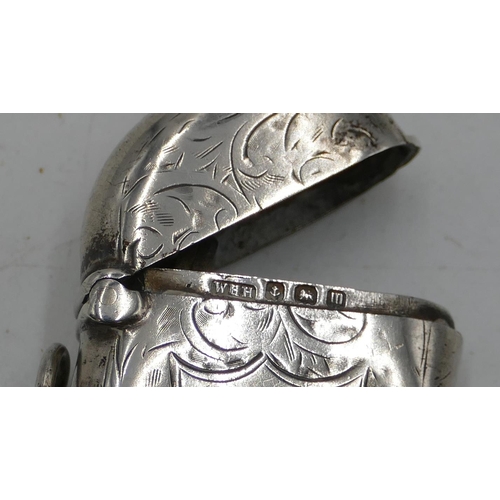 326 - A Birmingham silver nut shaped vesta case with hinged lid and engraved decoration (front and back de... 