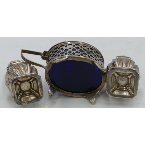 327 - An oval London silver mustard pot with hinged lid, enclosing blue glass liner and splayed feet, silv... 