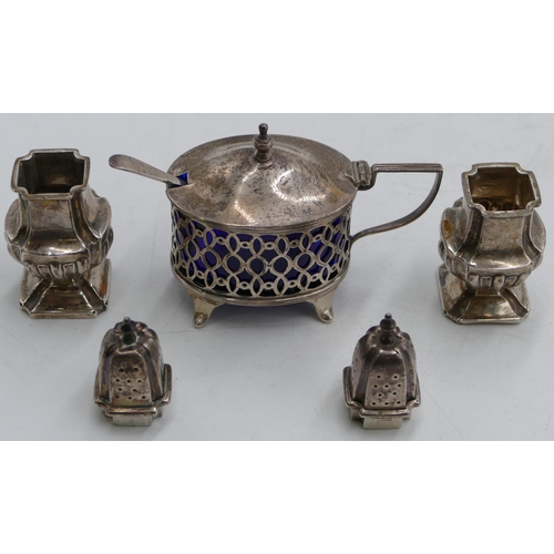 327 - An oval London silver mustard pot with hinged lid, enclosing blue glass liner and splayed feet, silv... 