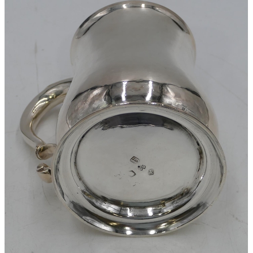 337 - A George II silver round bulbous shaped plain tankard with scroll handle on round sweeping foot, Lon... 