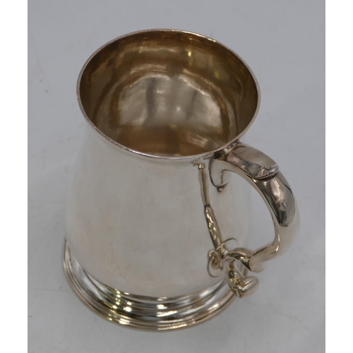 337 - A George II silver round bulbous shaped plain tankard with scroll handle on round sweeping foot, Lon... 