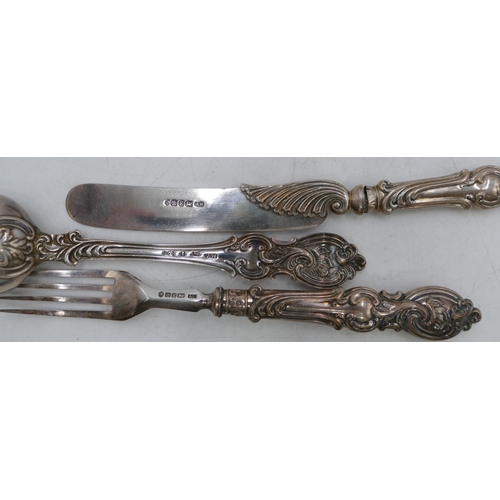 355 - A Victorian silver 3-piece christening set, 1 fork, knife and spoon with embossed scroll handles, Sh... 