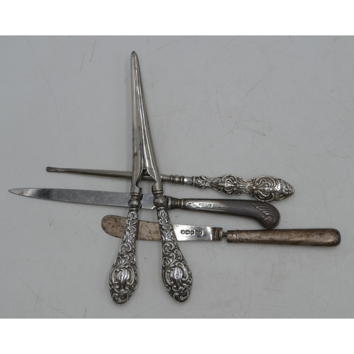 359 - A pair of Birmingham silver handled glove stretchers with embossed decoration, a similar silver hand... 