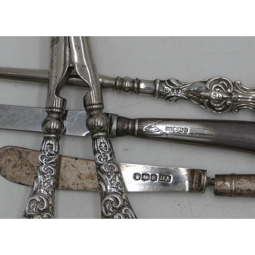 359 - A pair of Birmingham silver handled glove stretchers with embossed decoration, a similar silver hand... 