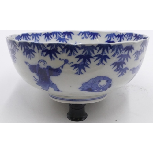 36 - An Oriental blue and white round bowl with allover figure decoration, 25cm diameter.