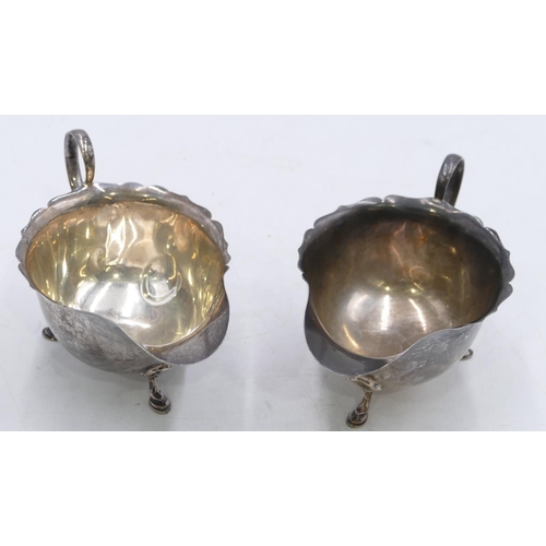 364 - A pair of Mappin and Webb Sheffield silver sauce boats with splayed hoof feet, 6.8oz.