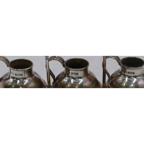 368 - A set of 3 Birmingham silver round bulbous shaped condiments in form of Jersey milk cans on silver p... 