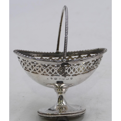 369 - A Victorian oval silver small sweetmeat dish with swing overhead handle with pierced decoration, Bir... 