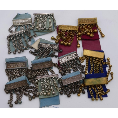 395 - A large quantity of various Masonic badges, ribbons, empty boxes, paperweights, hat etc.