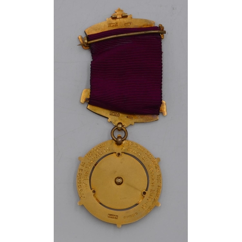 404 - A 9ct gold and enamelled Masonic medal, 32.7 grams gross, cased.