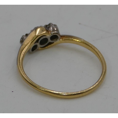 432 - An 18ct gold ladies 3 stone diamond ring with twist shoulders, size O, 2.5 grams.