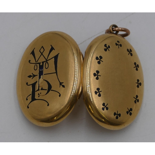 443 - An 18ct gold oval locket with blue enamelled monogram and floral decoration (some slight enamel miss... 