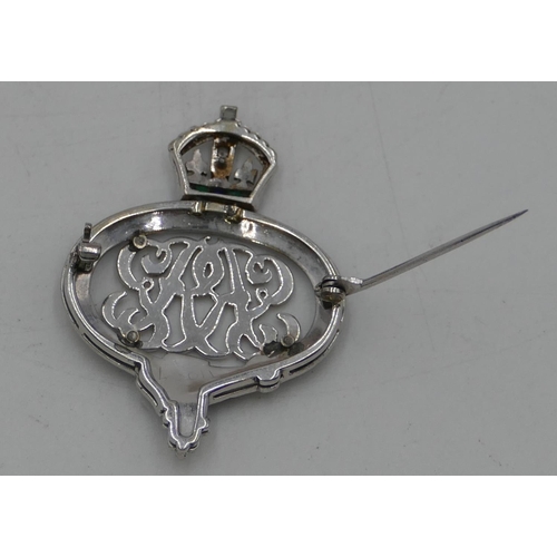 444 - A white gold or platinum military sweetheart brooch with enamelled decoration and mounted with crown... 