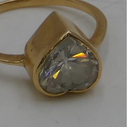 454 - A gold ladies ring set with heart shaped clear stone, size Q, 3.9 grams gross.