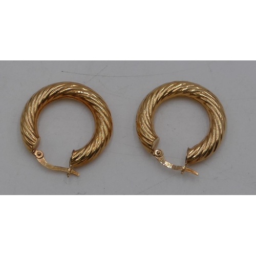 456 - A pair of 18ct gold hoop earrings, 4.3 grams.