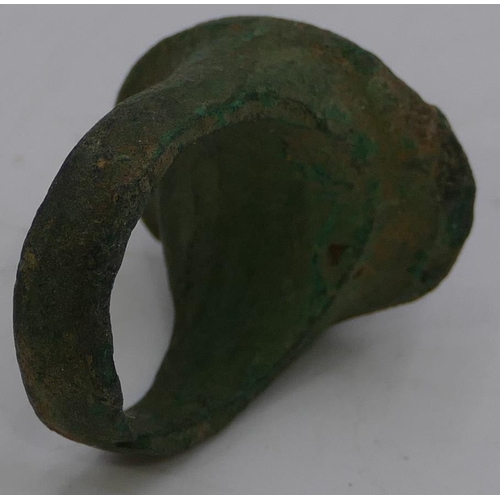 475 - A Roman style metal ring with oval top, raised figurehead of a gentleman, size O/P.