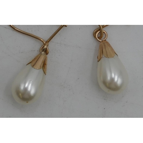 481 - A pair of gold drop pearl style earrings