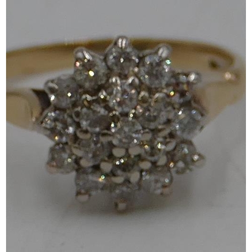 490 - An 18ct gold diamond cluster ring set with centre diamonds, surrounded by 18 diamonds, size K