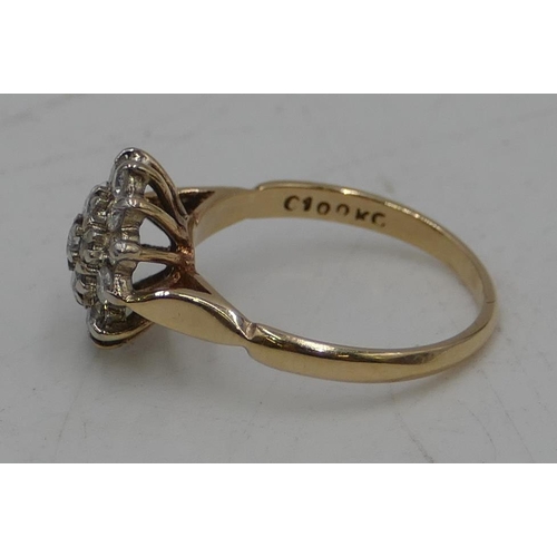 490 - An 18ct gold diamond cluster ring set with centre diamonds, surrounded by 18 diamonds, size K