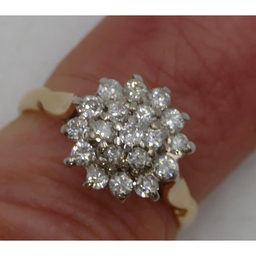 490 - An 18ct gold diamond cluster ring set with centre diamonds, surrounded by 18 diamonds, size K