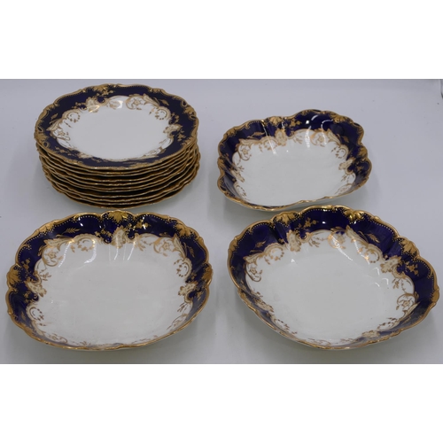 50 - A Bisto Waring and Gillows fruit service on white and royal blue ground with gilt floral and leaf de... 