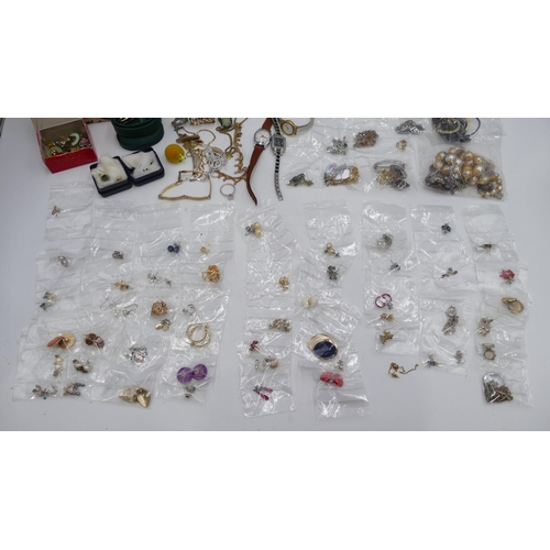 515 - A quantity of various earrings, brooches, wristwatch and other costume jewellery etc.