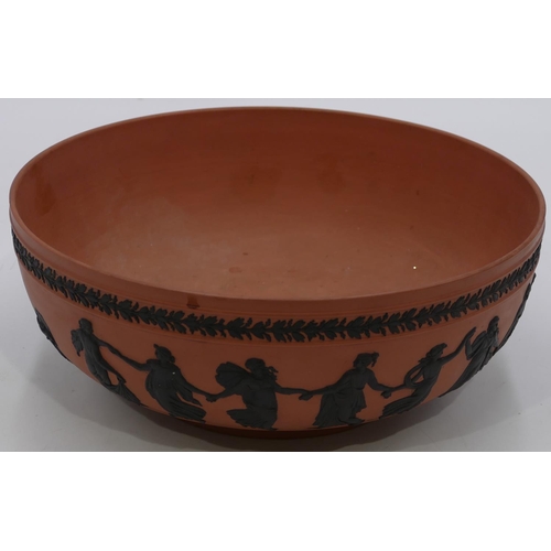 55 - A Wedgwood red Jasperware round fruit bowl with raised black classical figures of ladies, 26.5cm dia... 