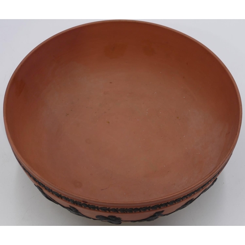 55 - A Wedgwood red Jasperware round fruit bowl with raised black classical figures of ladies, 26.5cm dia... 