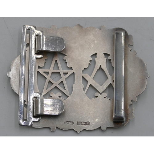 557 - A Birmingham silver heavy Masonic buckle with pierced and raised decoration, 9cm wide, 110.6g