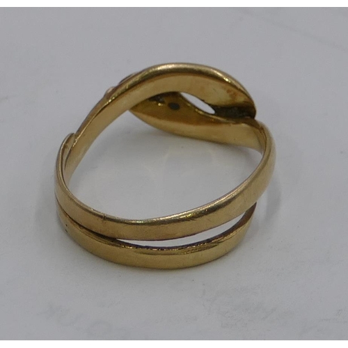 573 - A high carat gold gentleman's serpent twist ring, size U, 5.9 grams gross