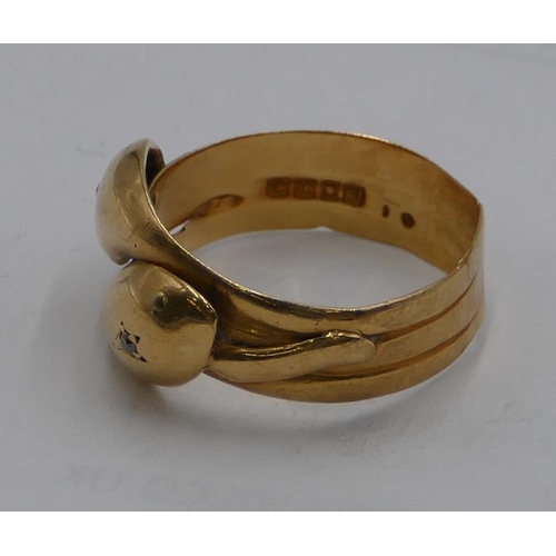 574 - An 18ct gold gentleman's twist ring set with 2 small diamonds as eyes (cut), size W, 7.5g gross