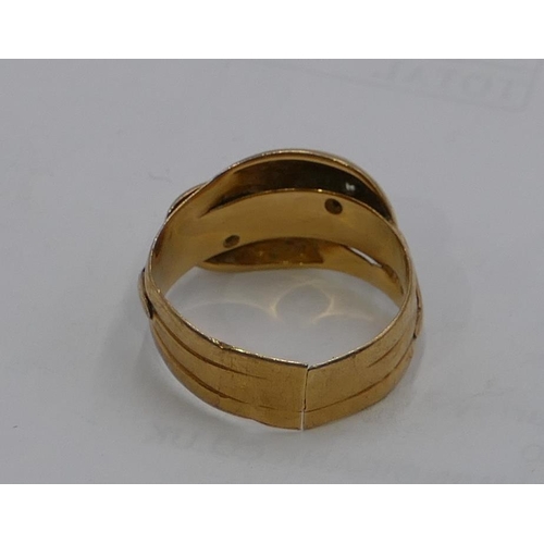 574 - An 18ct gold gentleman's twist ring set with 2 small diamonds as eyes (cut), size W, 7.5g gross