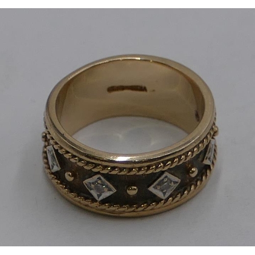 595 - A 9ct gold wide wedding band ring, inset with 5 small diamonds, size O, 7grams gross