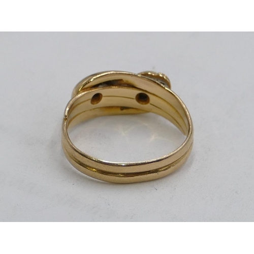 598 - A 18ct gold serpent twist ring, mounted with 2 small diamonds, size M, 4.5g