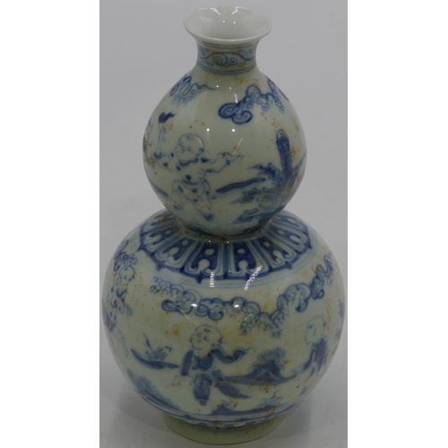 61 - An Oriental blue and white round double gould vase with children and landscape decoration, 18.5cm hi... 